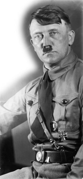 Adolf Hitler photographed in 1926. He wears the Iron Cross and Wound Badge, both of which he won in World War I.