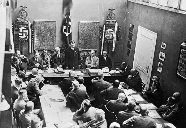 Hitler at a meeting of the party hierarchy in the mid-1920s. To his left are Strasser, Himmler and Rosenberg.