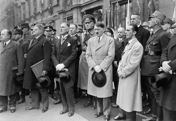 Hitler, Germany’s new chancellor, photographed in Berlin in March 1933. To his right stands Papen, to his left, Goebbels.