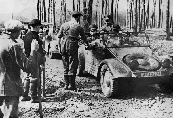 Dr Robert Ley (seated in the front of the car next to the driver), the head of the German Labour Front.