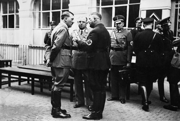 Hitler with the bullet-scarred Röhm. The Führer was quite fond of the SA leader, and went ahead with the purge reluctantly.