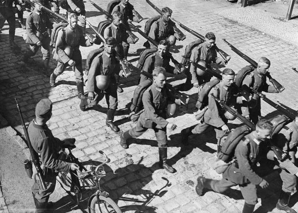 German troops march into the Saar in March following the plebiscite. It had been under League of Nations control.