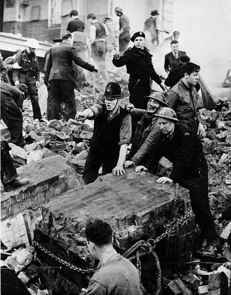 Police and resuce workers frantically clear debris after a German air raid on London