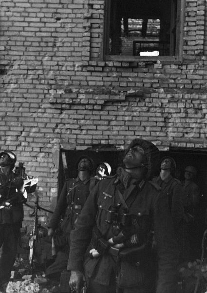 German troops trapped outside Stalingrad search the skies for the arrival of supplies being brought by aircraft