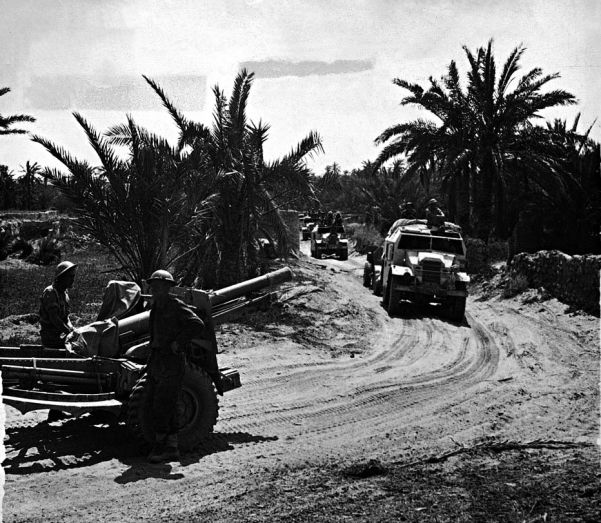 Guns and vehicles of the British Royal Artillery Regiment on the road to Tunis during the last phase of the war in Africa