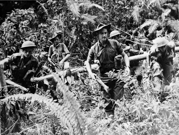 Australian troops in typical jungle terrain near Lae, Papua New Guines, during the offensive against the Japanese