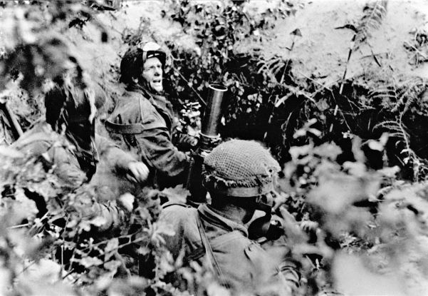British paratroopers in action near Arnhem. The enemy is close, as indicated by the acute angle of the mortar tube