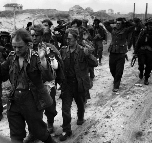 German prisoners are led away after their surrender on D-Day