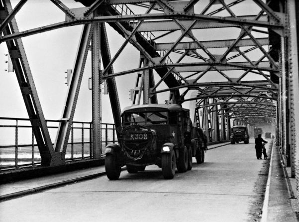 Allied vehicles rumble across the bridge at Nijmegen, Holland, during the disastrous Operation Market Garden