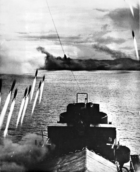 A barrage of rockets is unleashed against enemy beach defenses as the first wave of US assault units heads for Mindoro Island in the Philippines