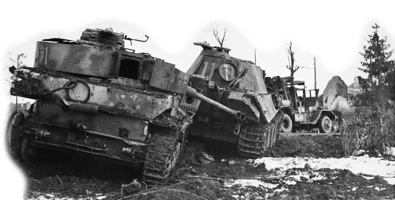 Abandoned German Panther and Panzer IV tanks in the Ardennes in late December